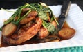 Pork chops with mushroom gravy spinach and potatoes on white plate Royalty Free Stock Photo