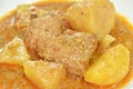 pork curry with slice potato and pineapple or mussaman on plate Royalty Free Stock Photo