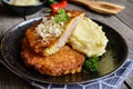 Pork cutlets coated in potato batter, studded with cheese and served with mashed potato Royalty Free Stock Photo