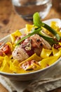 Pork fillet wrapped in ham on a bed of noodles Royalty Free Stock Photo