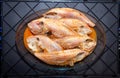 Pork fish or peroÃÂ¡ fish (Balistidae) cleaned on a plate on a dark background Royalty Free Stock Photo