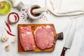 Pork. Fresh raw meat on a chopping board Royalty Free Stock Photo