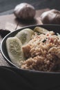 Pork fried rice is a common street food in Thailand. Served on a black wooden table Royalty Free Stock Photo