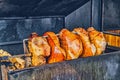 Pork ham meat is roasted on an open fire in the grill. Street Czech food. Prague, Czech Republic. Royalty Free Stock Photo