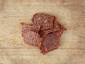 Pork jerky on a wood cutting board