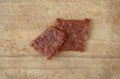 Pork jerky on a wood cutting board Royalty Free Stock Photo