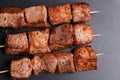 Pork kebabs on wooden skewers Royalty Free Stock Photo