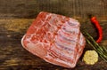 Pork loin joint on cutting board with herb Royalty Free Stock Photo