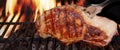 Pork Loin Steak On Hot Flaming Barbecue Grill With Fork