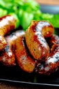 Pork meat sausages on a black plate Royalty Free Stock Photo