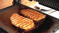 Pork meat steaks grilled on electric grill