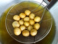 Pork meatballs being fried Royalty Free Stock Photo