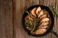 Pork medallions with cream sauce in cast iron pan