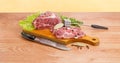 Pork neck on cutting board, meat tenderizer and kitchen knife Royalty Free Stock Photo