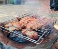 pork neck grill on old stove have smoke at thailand Royalty Free Stock Photo