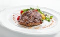 Pork Neck Steak with Mixed Salad on White Restaurent Plate Royalty Free Stock Photo