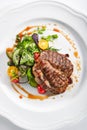 Pork Neck Steak with Mixed Salad on White Restaurent Plate Royalty Free Stock Photo