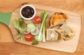 Pork pie and salad on chopping boards Royalty Free Stock Photo