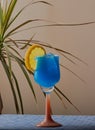 Cool blue cocktail garnished with lemon. Royalty Free Stock Photo