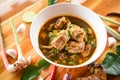 Pork rib curry spicy soup / pork bone with hot and sour soup bowl with fresh vegetables Tom Yum thai herbs and spices ingredients Royalty Free Stock Photo