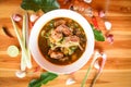 Pork rib curry spicy soup / pork bone with hot and sour soup bowl with fresh vegetables Tom Yum thai herbs and spices ingredients Royalty Free Stock Photo