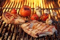 Pork Rib Steak, Tomato And Mushrooms On Hot BBQ Grill