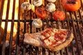 Pork Rib Steak, Tomato And Mushrooms On Hot BBQ Grill