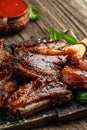 Pork ribs in barbecue sauce. vertical image. top view. place for text Royalty Free Stock Photo