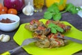 Pork ribs braised with soy sauce and vegetable tomato on the plate. Royalty Free Stock Photo