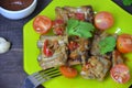 Pork ribs braised with soy sauce and vegetable tomato on the plate Royalty Free Stock Photo