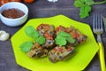 Pork ribs braised with soy sauce and vegetable tomato on the plate. Royalty Free Stock Photo