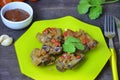 Pork ribs braised with soy sauce and vegetable tomato on the plate. Royalty Free Stock Photo