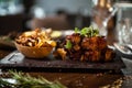 Pork ribs cooked at low temperature. Blackcurrant sauce, parsnip chips with Parmesan cheese. Delicious healthy meat food Royalty Free Stock Photo