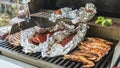 Pork ribs with grilled corn, shrimp, cauliflower and rack of lamb in barbecue. American food. View from above. Royalty Free Stock Photo