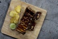 Pork ribs steak on a wooden container. Royalty Free Stock Photo