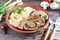 Pork roll with mushrooms and cheese served with mashed potatoes Royalty Free Stock Photo