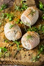 Pork rolls with spices and seasoning on old cutting board Royalty Free Stock Photo