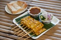 Pork satay skewered with bamboo stick and served with a sauce Royalty Free Stock Photo