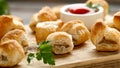 Pork sausage rolls with mustard and ketchup sauce on wooden board Royalty Free Stock Photo