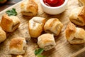 Pork sausage rolls with mustard and ketchup sauce on wooden board Royalty Free Stock Photo