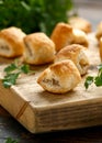 Pork sausage rolls with mustard and ketchup sauce on wooden board Royalty Free Stock Photo