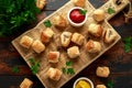 Pork sausage rolls with mustard and ketchup sauce on wooden board Royalty Free Stock Photo