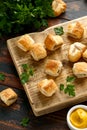 Pork sausage rolls with mustard and ketchup sauce on wooden board Royalty Free Stock Photo