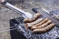 pork sausages fried on coals on the grill Royalty Free Stock Photo