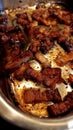 Pork scratching in a stainless steel tray