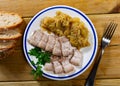 Pork served with stewed eggplant on plate