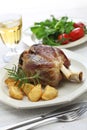 Pork shank with roasted potatoes, italian cuisine