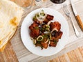 Pork shashlik with onion, greenery and lavash Royalty Free Stock Photo