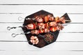 Pork shish kebab with onions and tomatoes. Barbecue. Top view. Free space for your text. Royalty Free Stock Photo