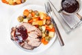 Pork shoulder in honey parmesan and soy souse, prepared in slow cooker or crockpot, served with carrot, potato and brussel cabbage Royalty Free Stock Photo